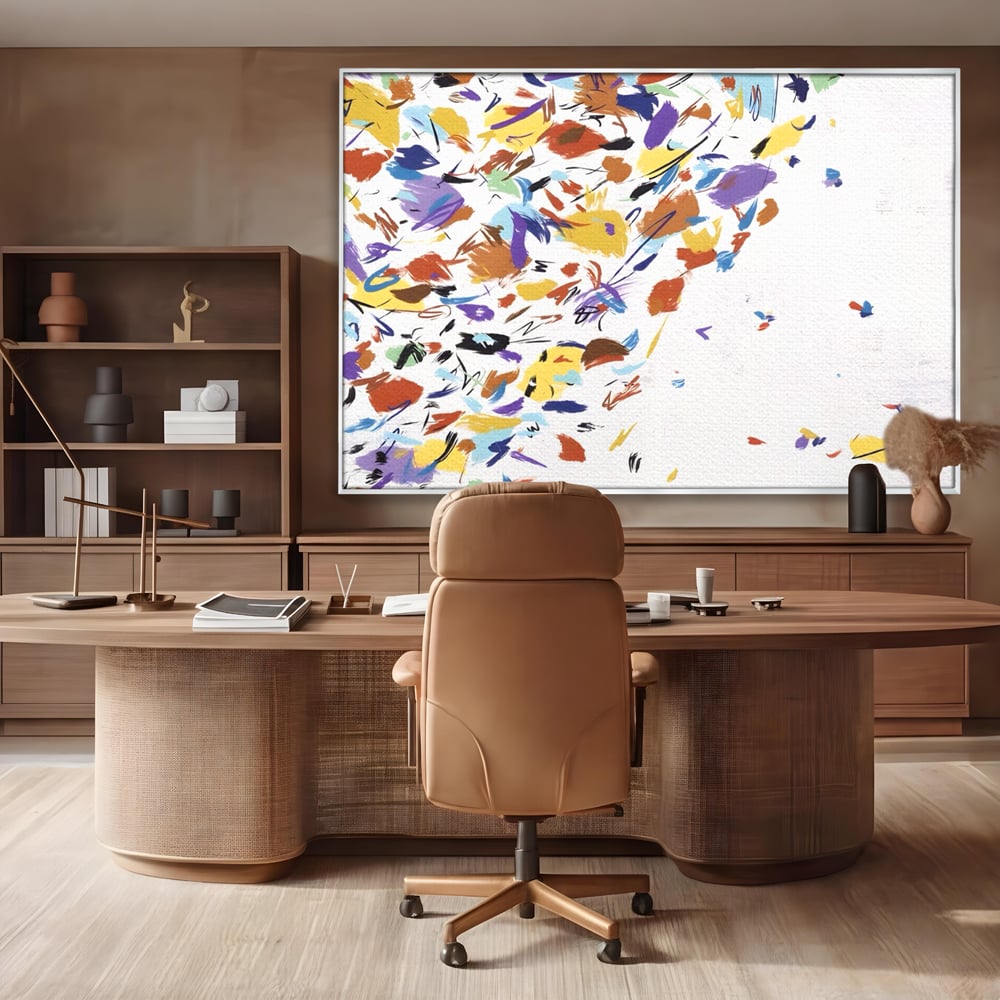 Tablou canvas cu pictura abstracta cu frunze colorate, in rama de aluminiu argintiu, pe perete intr-un birou